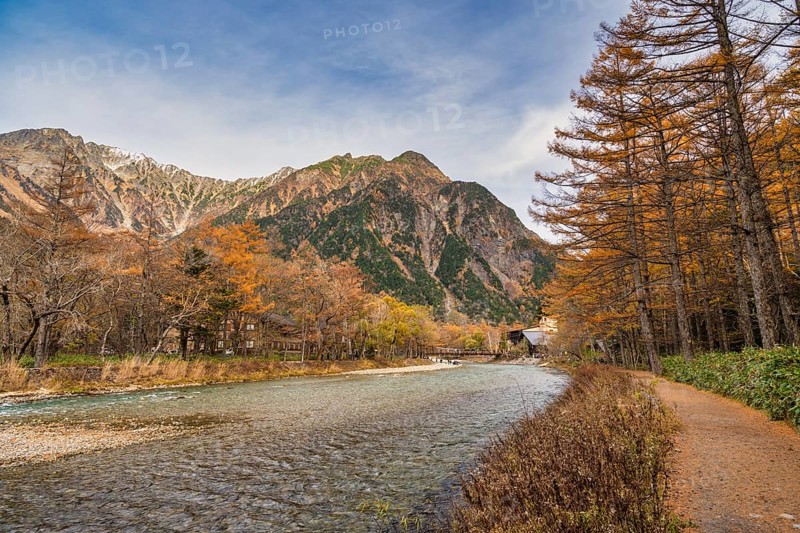 Nature landscape at Kamikochi Japan, autumn foliage season with pond and mountain