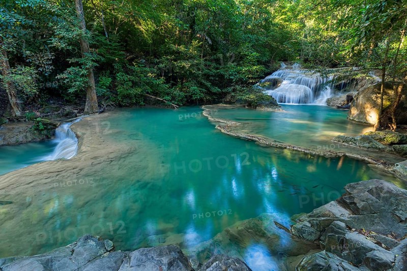Erawan Waterfall with fish in water in Kanchanaburi Province, Thailand, Asia