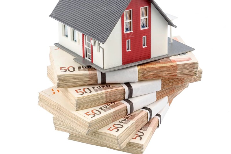 House on euro banknotes, symbolic photo for house purchase, financing, building society savings Austria