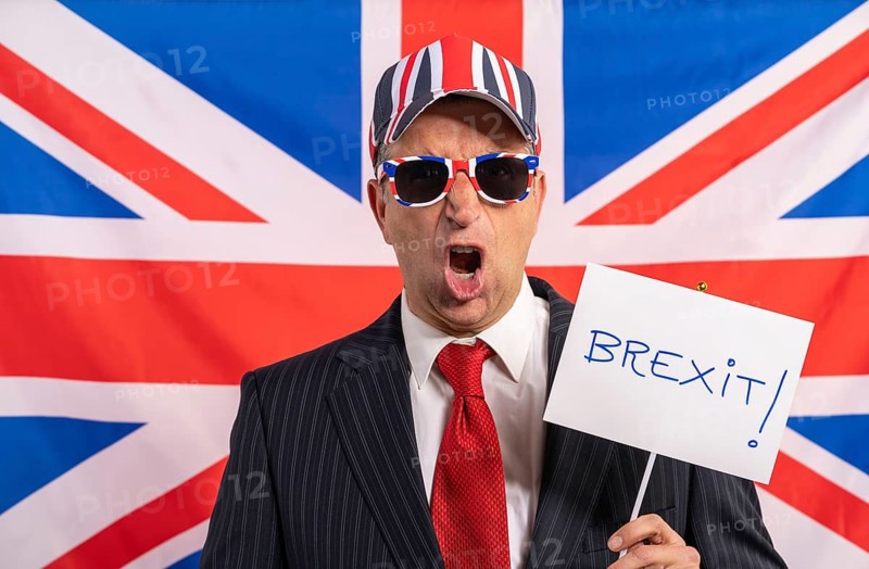 British male businessman with Brexit banner and UK flag