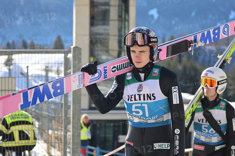 Marius Lindvik (Norway/NOR) on his way to the ski jump during the qualification for the opening ski jumping event of the 73rd Four Hills Tournament in Oberstdorf, Oberstdorf, Germany / Germany