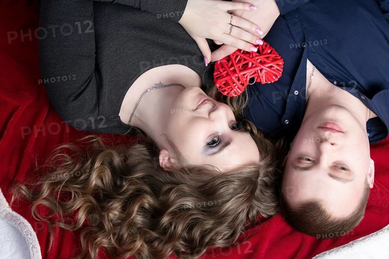Couple in love from top to bottom. Man and woman with a red heart. Beautiful young man and woman.close up man and woman together.valentine's day