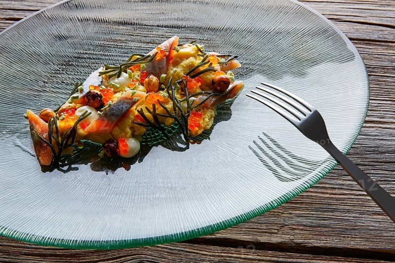 Smoked sardines salad with creamy cheese corn codium and hazelnuts
