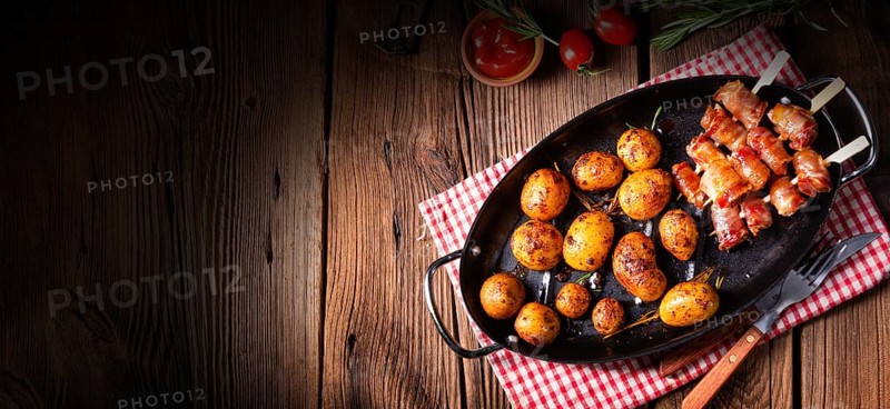 Rustic dates wrapped in bacon and young roasted potato