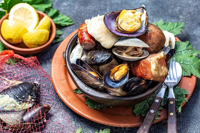 Food, Food, Famous traditional dish of the south of Chile and the Chiloe archipelago, Curanto Kuranto. Different seafood and meat cooked in a pit on the coals under the ground