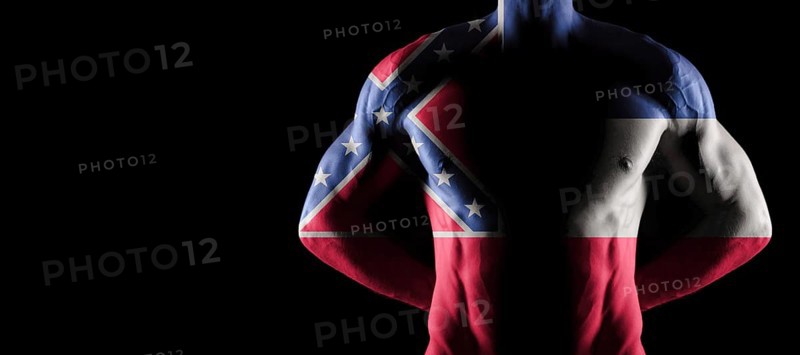 Mississippi flag on muscled male torso with abs, Mississippi bodybuilding concept, black background