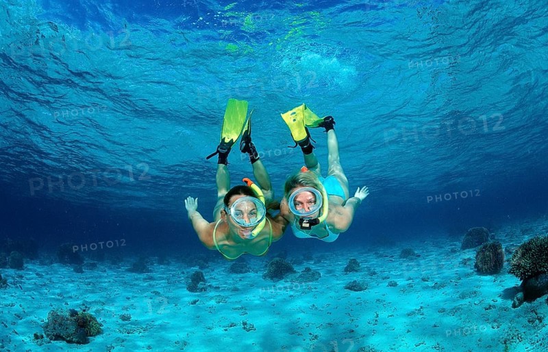 Two woman snorkelling, Indian Ocean, Maldives, Asia