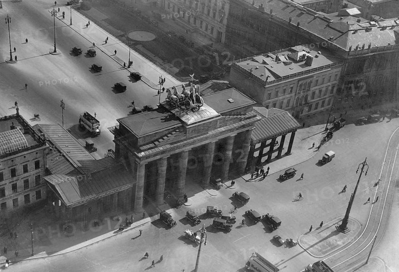 Berlin in the 1930s. An aerial view of Brandenburger gate on december 15 1933. An 18th- century neoclassical monument and one of the best-known landmarks of Germany located in the centre of Berlin. After World War II the Brandenburger gate was located in the soviet occupation zone and the Berlin wall was constructed directly next to it. The gaten is now considered a symbol of European unity and peace. The gate is the monumental entry to the boulevard Under den Linden