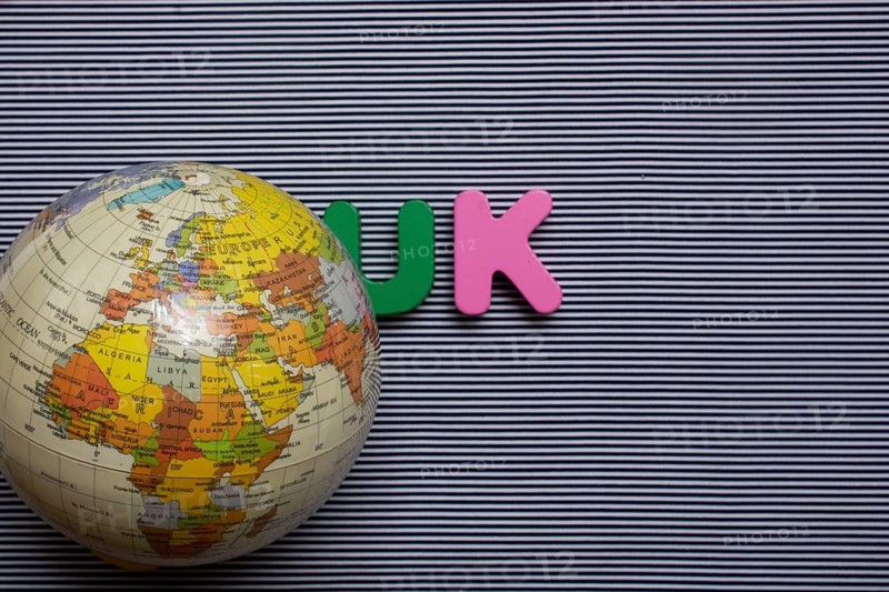 Abbreviation of united kingdom UK on wood background
