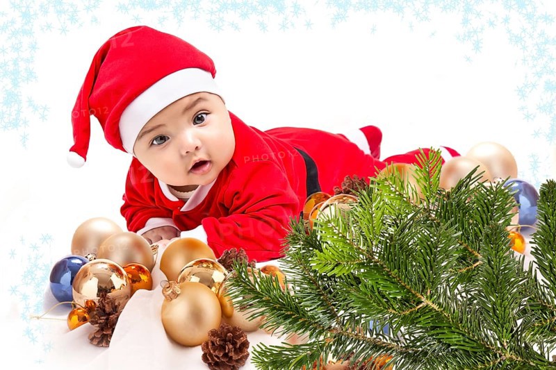 Baby in Santa costume. Christmas tree isolated on white