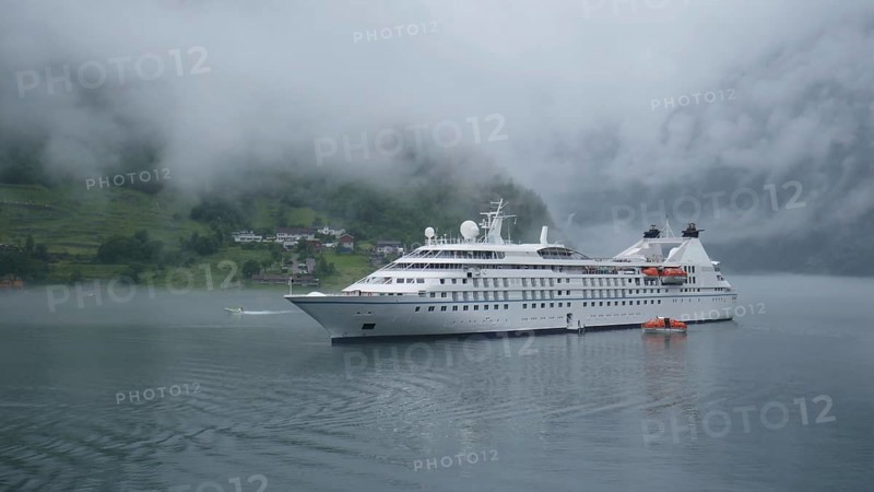 Cruise ship in the fog. Geirangerfjord, Norway, Europe