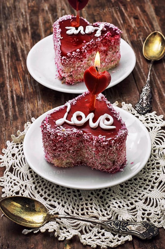 Cake with fruit filling in the shape of heart with the inscription love
