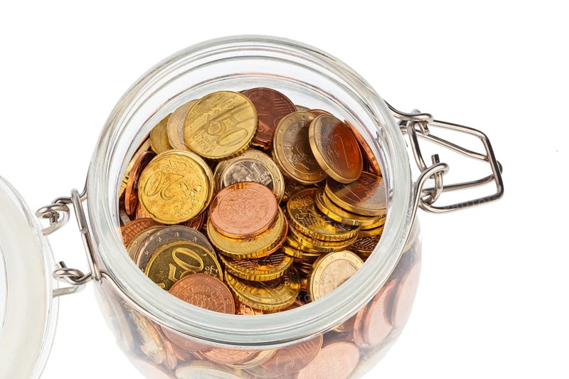 A jar with coins of the European currency, the euro. Provision, saving and security for your pension. Austria