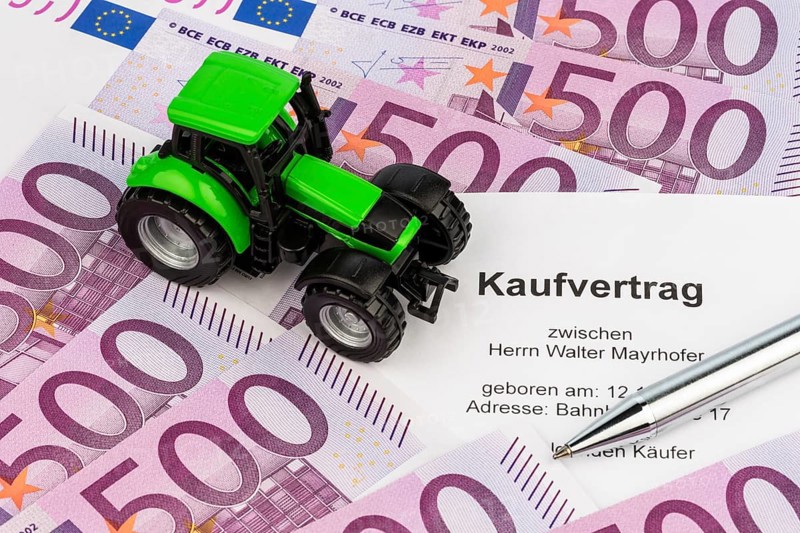 The purchase contract for a new tractor. With euro money and biros