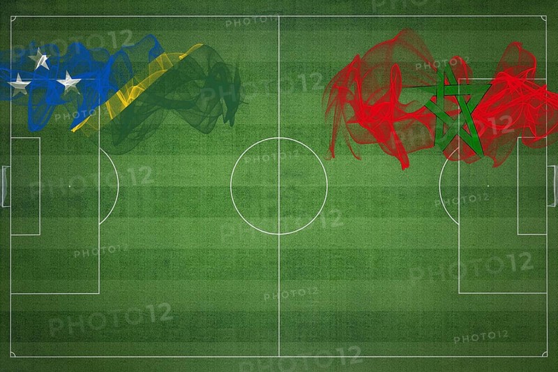 Solomon Islands vs Morocco Soccer Match, national colors, national flags, soccer field, football game, Competition concept, Copy space
