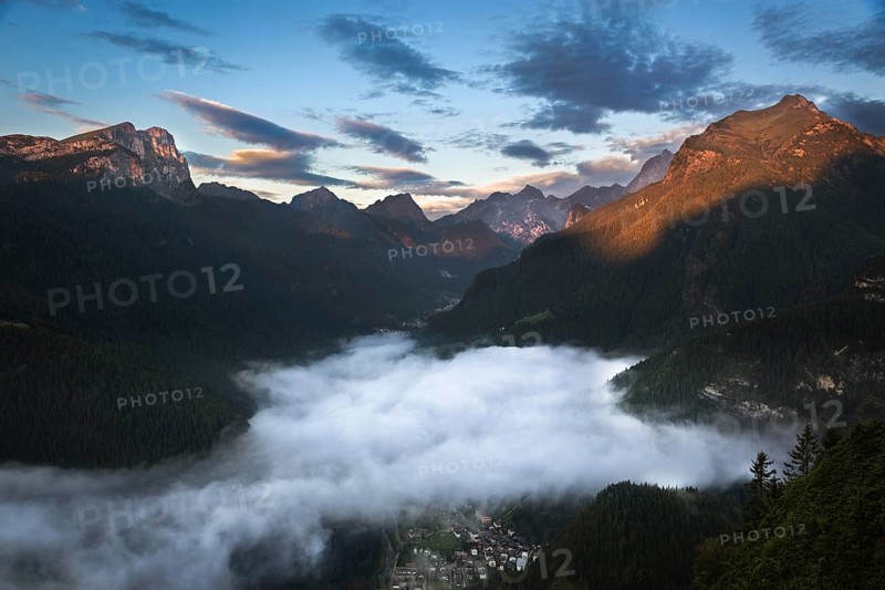 Valley in Dolomites with early morning clouds, Alps, Italy, Europe