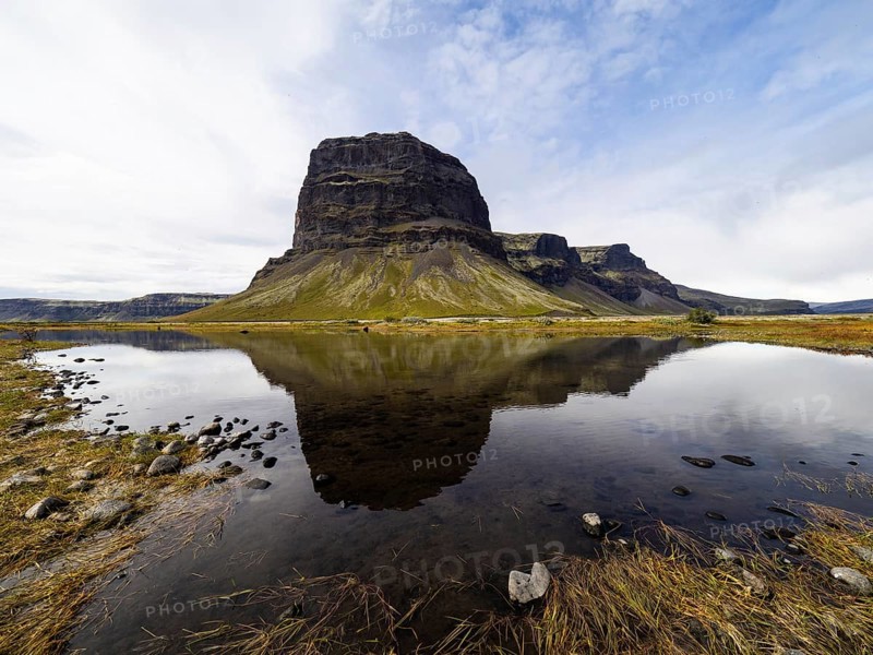 Rock massif Lomagnupur or Lómagnúpur, reflection in a pond, South Iceland, Iceland, Europe