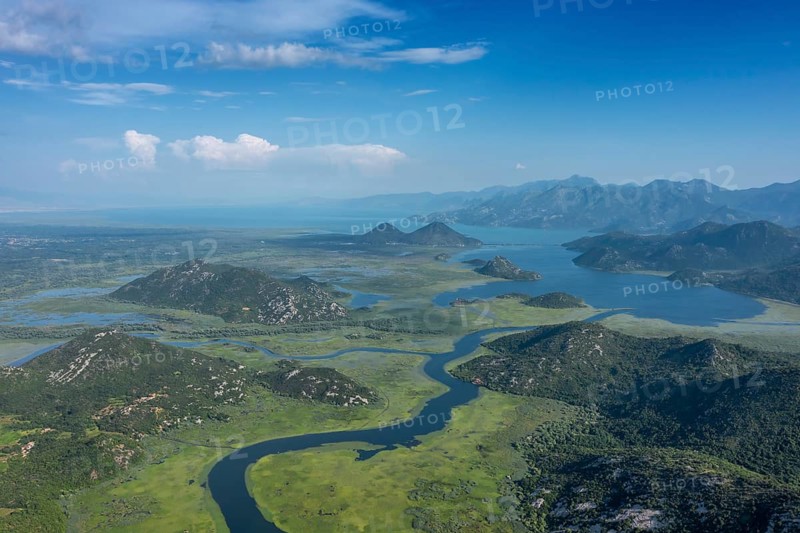 Aerial view of Rijeka Crnojevica, beautiful river between mountains flowing into Skadar Lake, Montenegro, Europe