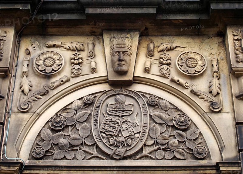 Sowerby bridge, west yorkshire, united kingdom, 16 july 2019: carved heraldic logo over the former lancashire and yorkshire bank in sowerby bridge