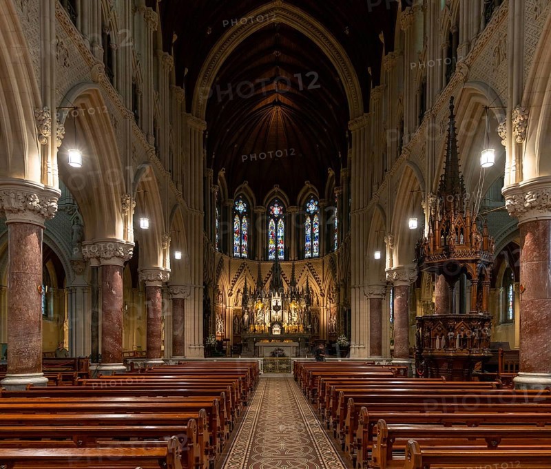 Cobh, Ireland, 15 August, 2022: view of the central nave and altar with the elegant wooden pulpit in the Cobh Cathedral, Europe