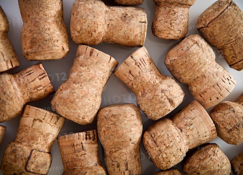 Dated wine bottle corks on the wooden background. Close up
