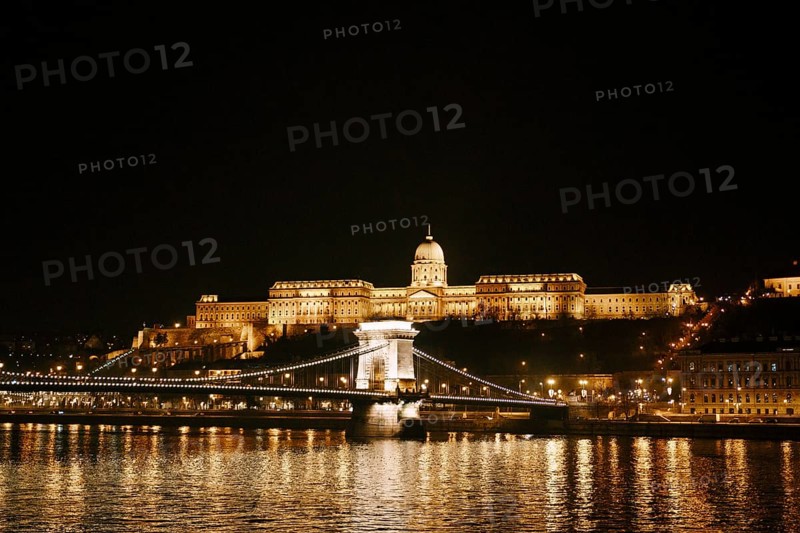 Panorama of the city with the ensemble of the Royal Palace in Budapest at night with illumination.
