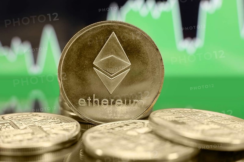 Ethereum ETH cryptocurrency coin on the green chart background. Bubble or bull trend concept
