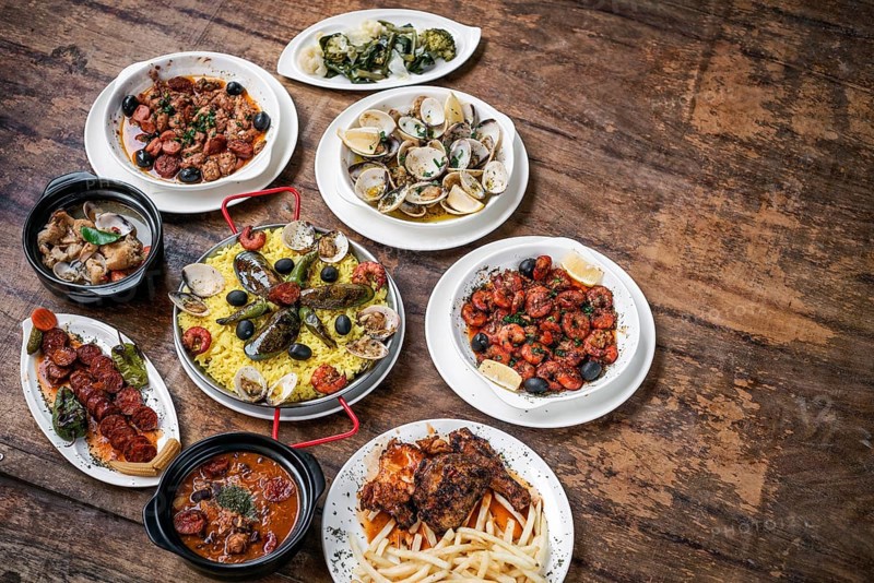 Mixed portuguese traditional rustic tapas famous food selection on wood table