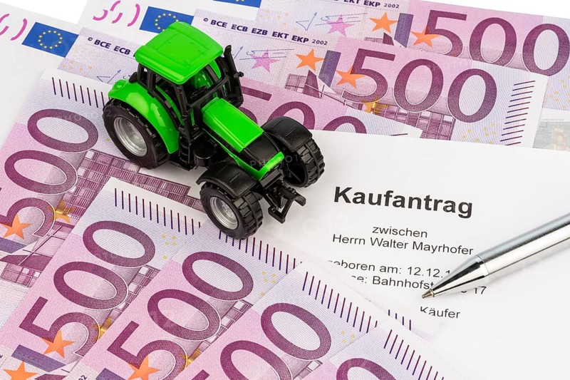 The purchase contract for a new tractor. With euro money and biros