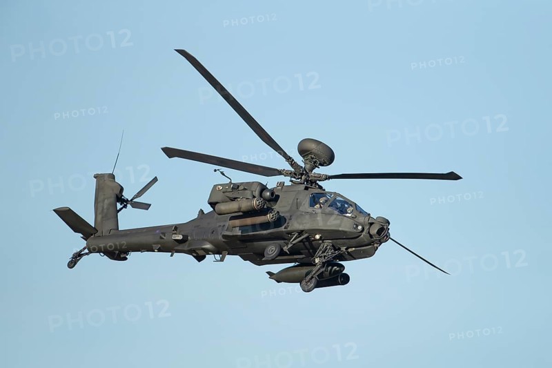 Agusta Westland AH-64 Apache helicopter aircraft in British Army air corps colours flying, England, United Kingdom, Europe