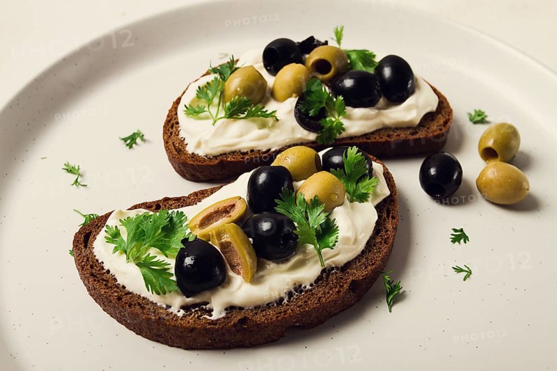 Breakfast, sandwiches, with cream cheese, olives, top view