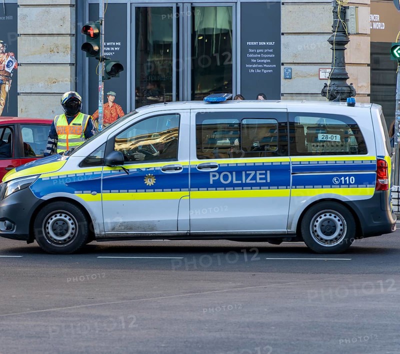 Police officer of the Berlin motorbike squad regulates traffic, Unter den Linden, Berlin, Germany, Europe