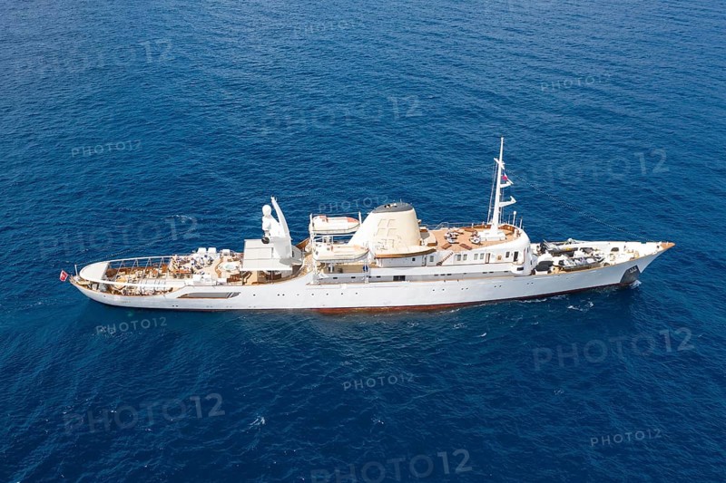 Aerial view 99 metre long motor yacht Christina O, former frigate built in 1942 by Canadian Vickers, converted for Aristotle Onassis, on board were Maria Callas, Winston Churchill, John F. and Jackie Kennedy, Tito, Grace Kelly, Prince Rainier III of Monaco, Frank Sinatra, Richard Burton, Elizabeth Taylor, Greta Garbo, John Wayne, Marilyn Monroe, John D. Rockefeller, Paul McCartney, Prince Andrew, Sarah Ferguson, Madonna, Johnny Depp. Here the yacht is cruising off Menton on the French Riviera, Mediterranean Sea