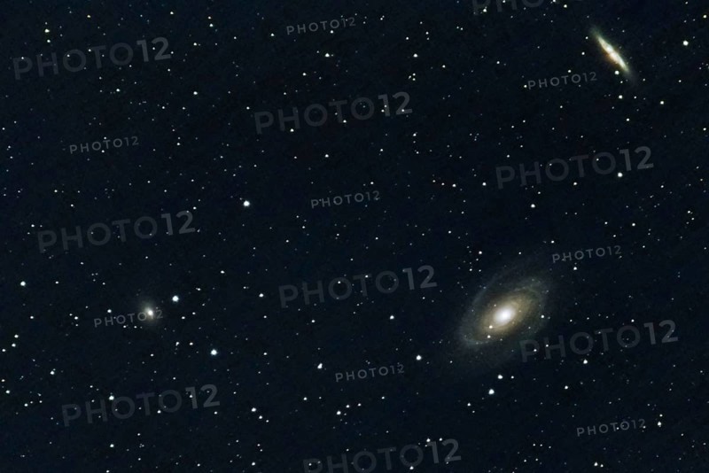 Two spiral galaxies (M 81 and M 82) and other galaxies, embedded in a star-studded deep space, Haibach, Lower Bavaria
