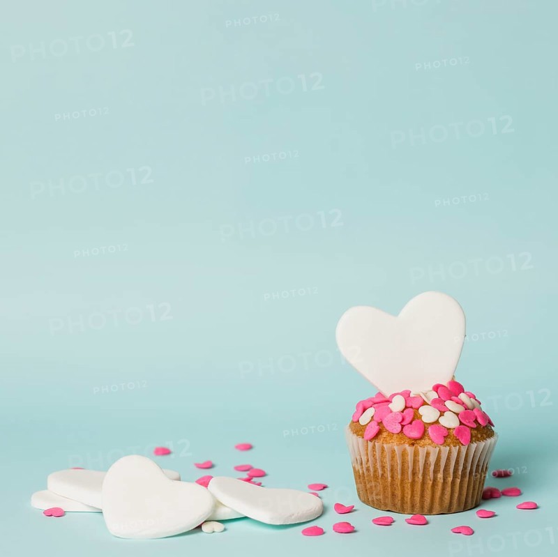 Tasty cake with decorative hearts