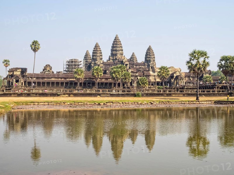 The iconic towers of Angkor Wat and the lake at the west gate, Siem reap, Cambodia, Asia