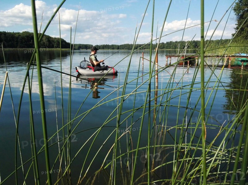 Angler with belly boat on Lake Lübbe