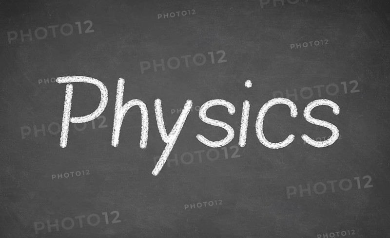 Physics lesson on blackboard or chalkboard. written in white chalk