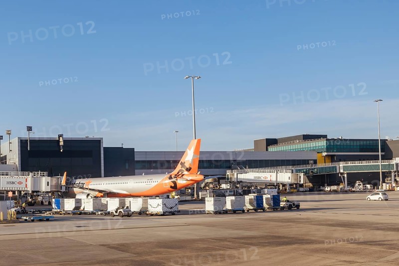 Melbourne, Australia, March 03 2023: Jetstar aircraft at boarding gates at Melbourne Tullamarine Airport in Victoria, Australia, Oceania