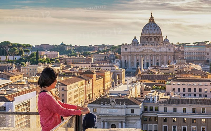 Rome Vatican Italy high angle view sunset city skyline with woman tourist