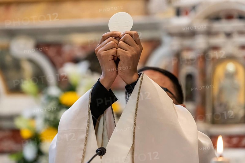 The elevation of the Sacramental Bread during the catholic liturgy