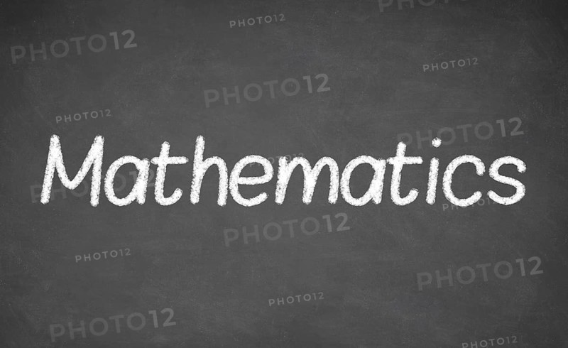 Mathematics lesson on blackboard or chalkboard. written in white chalk
