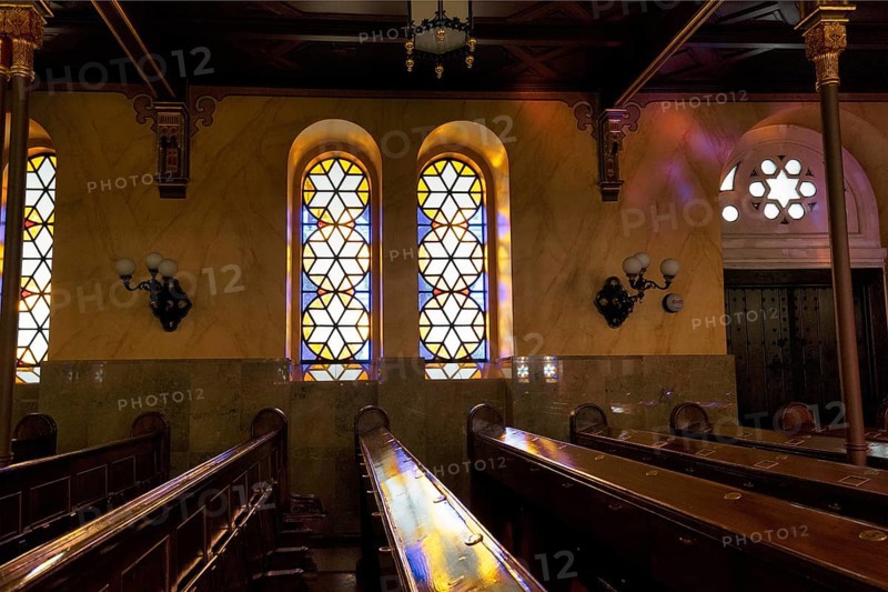 Incidence of light through stained glass windows, star, reflections, wooden benches, Great Synagogue, Nagy Zsinagoga, Pest district, Budapest, Hungary, Europe