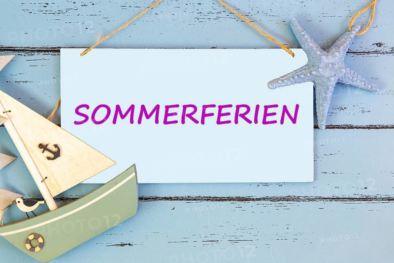 Photomontage: Sign with text SUMMER HOLIDAYS on a blue wooden board with maritime accessories