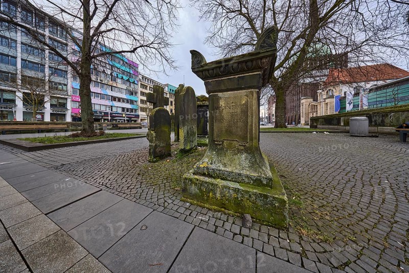 Historic gravestones, general architecture, pavement made of cobblestones and paving slabs, diffuse light, cloudy, Goseriede street, Hanover, state capital, Hanover region, Lower Saxony, Germany, Europe