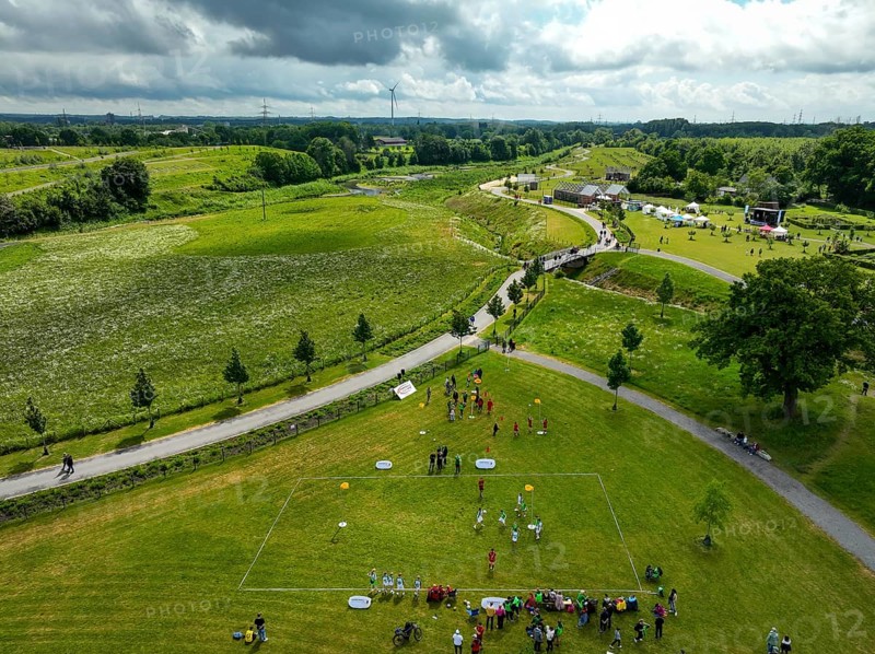 Recklinghausen, Castrop-Rauxel, Ruhr area, North Rhine-Westphalia, Germany - Sports festival in the EMSCHERLAND adventure park, a new nature and water adventure park on the renaturalised Emscher, at the water cross of the Emscher with the Rhine-Herne Canal on the city boundary of Recklinghausen and Castrop-Rauxel. Flood protection by expanding the area. The ecological focus at the confluence of the Suderwicher Bach and Emscher will also become a future garden for the International Garden Exhibition IGA 2027. Before the renaturalisation, the Emscher river system was an open, above-ground wastewater channel, combined sewer with surface water and wastewater