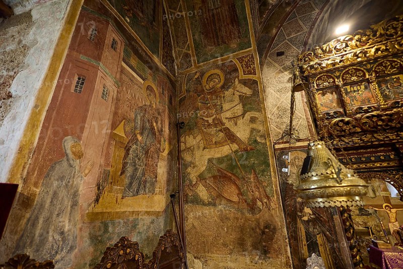 Richly decorated altar table and frescoes in a church showing detailed religious scenes, Thari Monastery, Moni Thari, near Gadouras Reservoir, remote mountain region, Rhodes, Dodecanese, Greek Islands, Greece, Europe