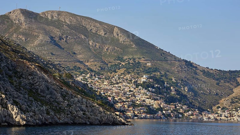 Coastal town on mountainous shores, Symi Town, Symi, Dodecanese, Greek Islands, Greece, Europe