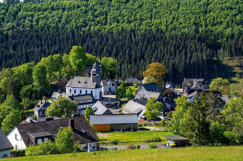 The village of Nordenau, district of Schmallenberg, in the Hochsauerland district, St Hubertus Church, North Rhine-Westphalia, Germany, Europe