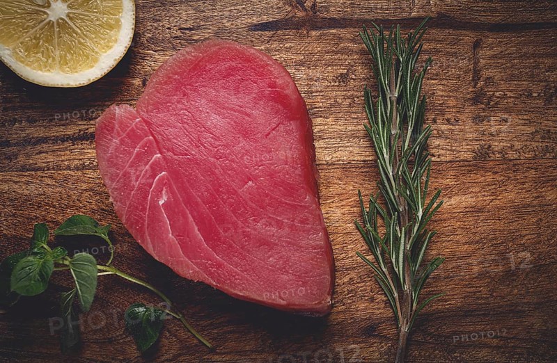Fresh red tuna fillet, for steak, raw, top view, on a cutting board, no people